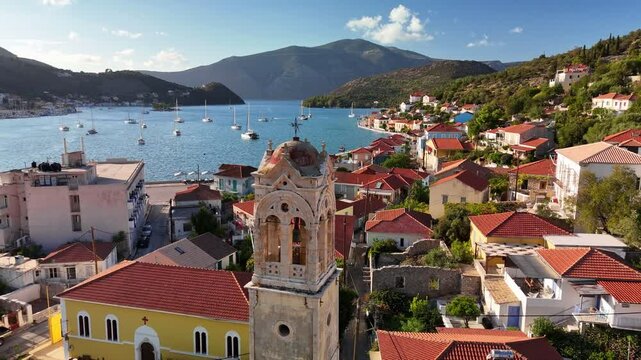 Ithaki or Ithaca island with breathtaking aerial views of picturesque village nestled along the coast. Capital and port of Ithaki island, Ionian, Greece. Old bell tower, old town and bay with yachts