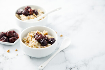 Homemade pudding with warm cherries and coconut