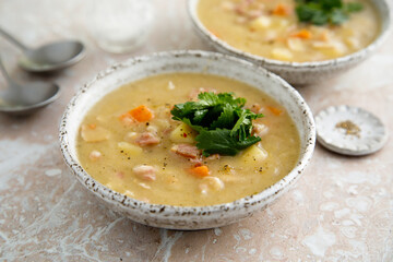 Homemade pea soup with smoked meat