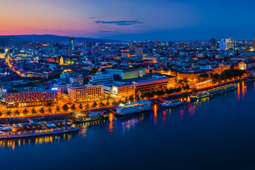 Bratislava, Slovakia - June 2022: City skyline on the shores of the Danube river; Bratislava castle, the old town, Eurovea; UFO bridge; SNP bridge; Apollo Bridge