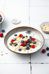 Granola with yogurt, fresh berries and coconut