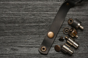 Alfa buttons and leather craft manual hand press attachments close up background. Top view.