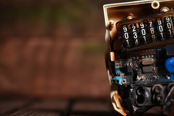 Burnt electric meter on the table close up background. Replacement of electricity meter.