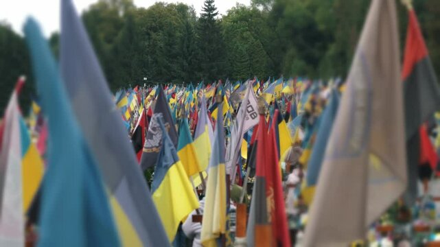 The graves of dead Ukrainian soldiers who died during the Russian invasion of Ukraine. Lviv Field of Mars, on which there are a large number of military graves with flags and Ukrainian symbols