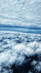 A bunch of floating clouds shot from a plane