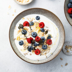 Granola with yogurt, fresh berries and coconut