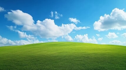 Fototapeta premium Serene green field under a blue sky with fluffy white clouds breathtaking landscape