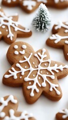 Gingerbread cookies decorated with snowflake icing and sprinkles.