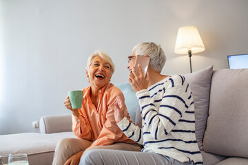 Happy Senior Women Laughing and Chatting at Home