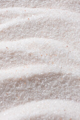 Natural Himalayan Pink Salt Fine Ground Top View Abstract Texture Vertical Background