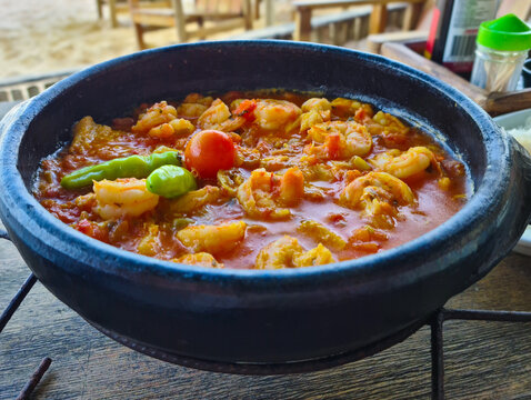 Moqueca, a traditional Brazilian dish with badejo fish and large shrimp, Badejo