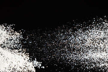Obraz premium Abstract black and white background of pouring flour, space for text