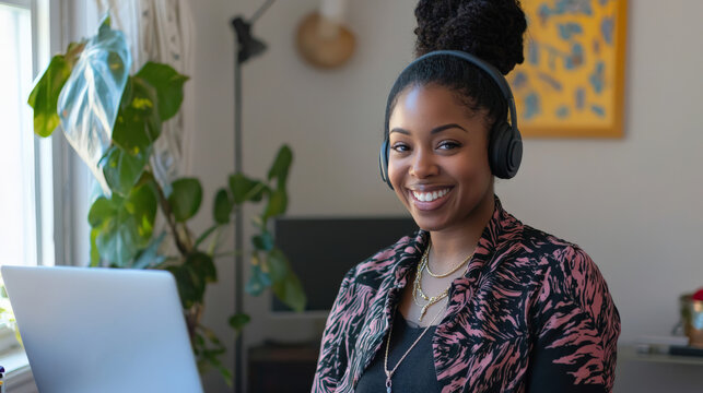 A virtual assistant smiling while managing tasks from a home office, laptop and headset ready