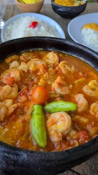 Moqueca, a traditional Brazilian dish with badejo fish and large shrimp, Badejo