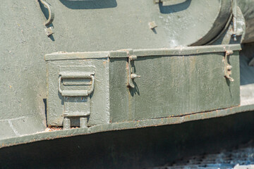 Military war tank. Part of the weapon in close up. Military khaki coloring. Metal weapons. Arms...