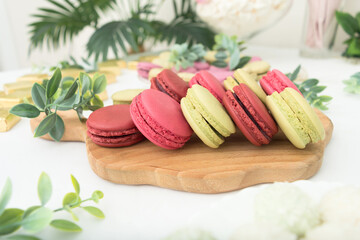 Group of green and red sweet macaroons. Closeup view