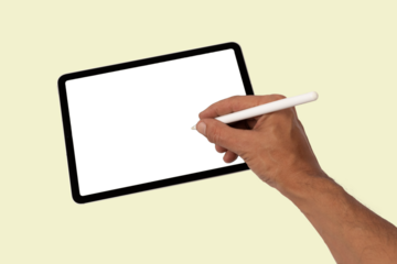 Male hand drawing or writing on a tablet blanc screen with smart pencil green background