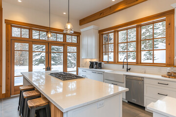 A bright modern kitchen with wooden accents and large windows showing a snowy view creating a cozy and warm interior space  
