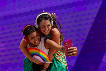 Lesbian couple capturing a joyful selfie