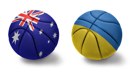 basketball balls with the national flags of ukraine and australia on the white background.