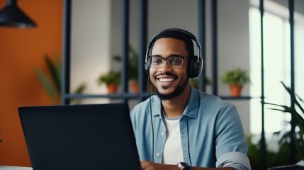 Fototapeta premium A smiling man with a wireless headset enjoys a moment at his desk, embodying the essence of modern connectivity and ease.