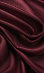 Obraz premium Elegant burgundy silk fabric background with smooth texture for design and textile applications