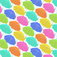 Pattern with colorful umbrellas.Multicolored umbrellas on a colored background in a seamless vector pattern.