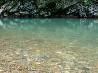 The river, with its rapid flow and majestic cliffs, creates a breathtaking landscape, reflecting the strength and beauty of the wild nature