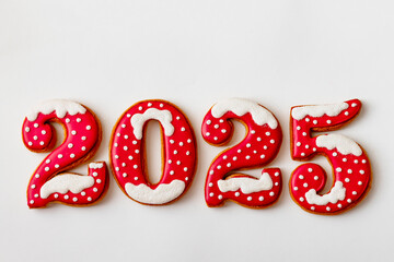 Christmas and New Year banner gingerbread cookies numbers 2025 on white background, copy space,...