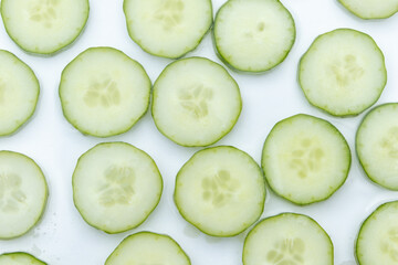 slices of fresh cucumber in clear water