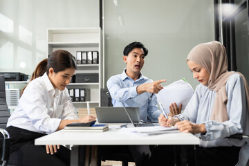 Angry boss blames sad female employee for incompetence computer error in office.