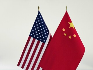 Flags of the United States and China displayed together, symbolizing international relations
