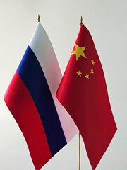 Flags of Russia and China displayed together, symbolizing diplomatic ties