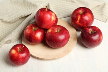 Fresh ripe red apples on white wooden table