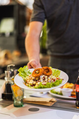 Delicious Salad with Onion Rings Served on a Plate