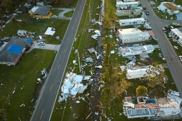 Destroyed by hurricane Ian suburban houses in Florida mobile home residential area. Consequences of...