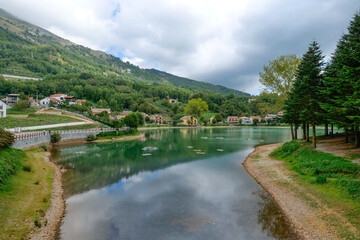 Fototapeta premium View of a dam of Sirino lakelake in the mountains of Basilicata, Italy.