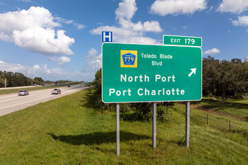 Freeway directional exit sign on interstate road in Florida, USA. I-75 highway junction leading to...