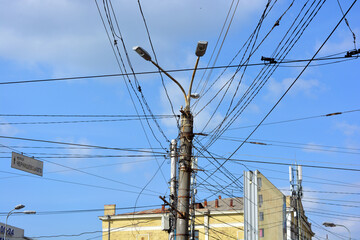 Architecture, unusual places. Electricity, electrical wiring, electrical engineering. Many black...