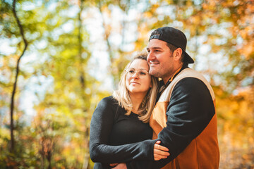 Fototapeta premium photo of harmony romantic couple in october autumn forest town park