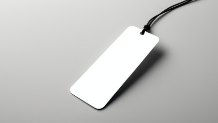 Fototapeta premium Realistic bookmark mockup featuring a simple, rectangular design. Perfect for showcasing book-related designs or promotional materials in a clean, minimal setting