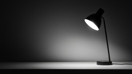 A black lamp is lit up on a table