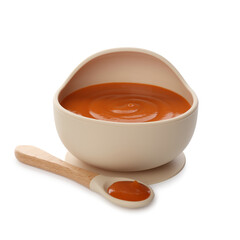 Delicious baby food in bowl and spoon isolated on white