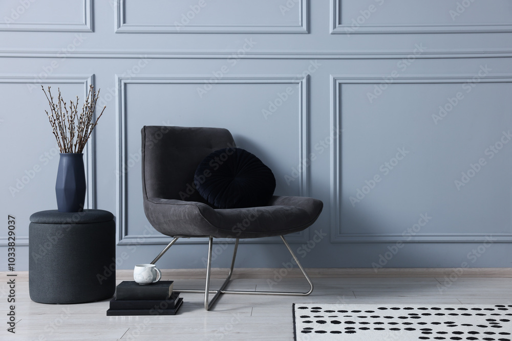 Wall mural Stylish stool, chair and vase near light grey wall indoors, space for text