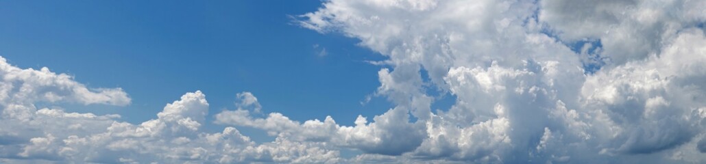 Blue sky and beautiful clouds shape. Image for background and wallpaper.Blue sky with clouds background.Sky daylight. Natural sky composition. Element of design.