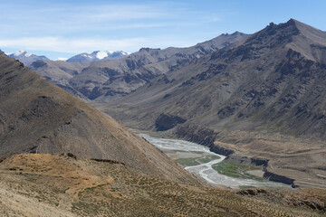 A winding river cutting through a rugged mountain landscape
