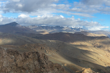 Majestic mountain range under a cloudy sky