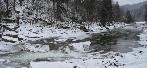 Snow-capped mountains of the Carpathians, river rapids of the Prut and spruce forest - Yaremche