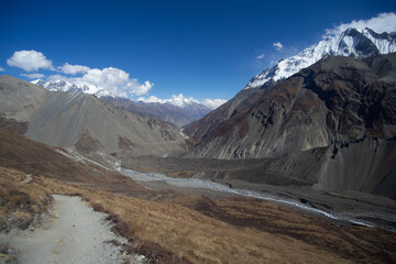 Breathtaking view of towering mountains under a clear blue sky.