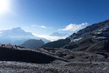 A stunning view of snow-capped mountains under a clear blue sky.